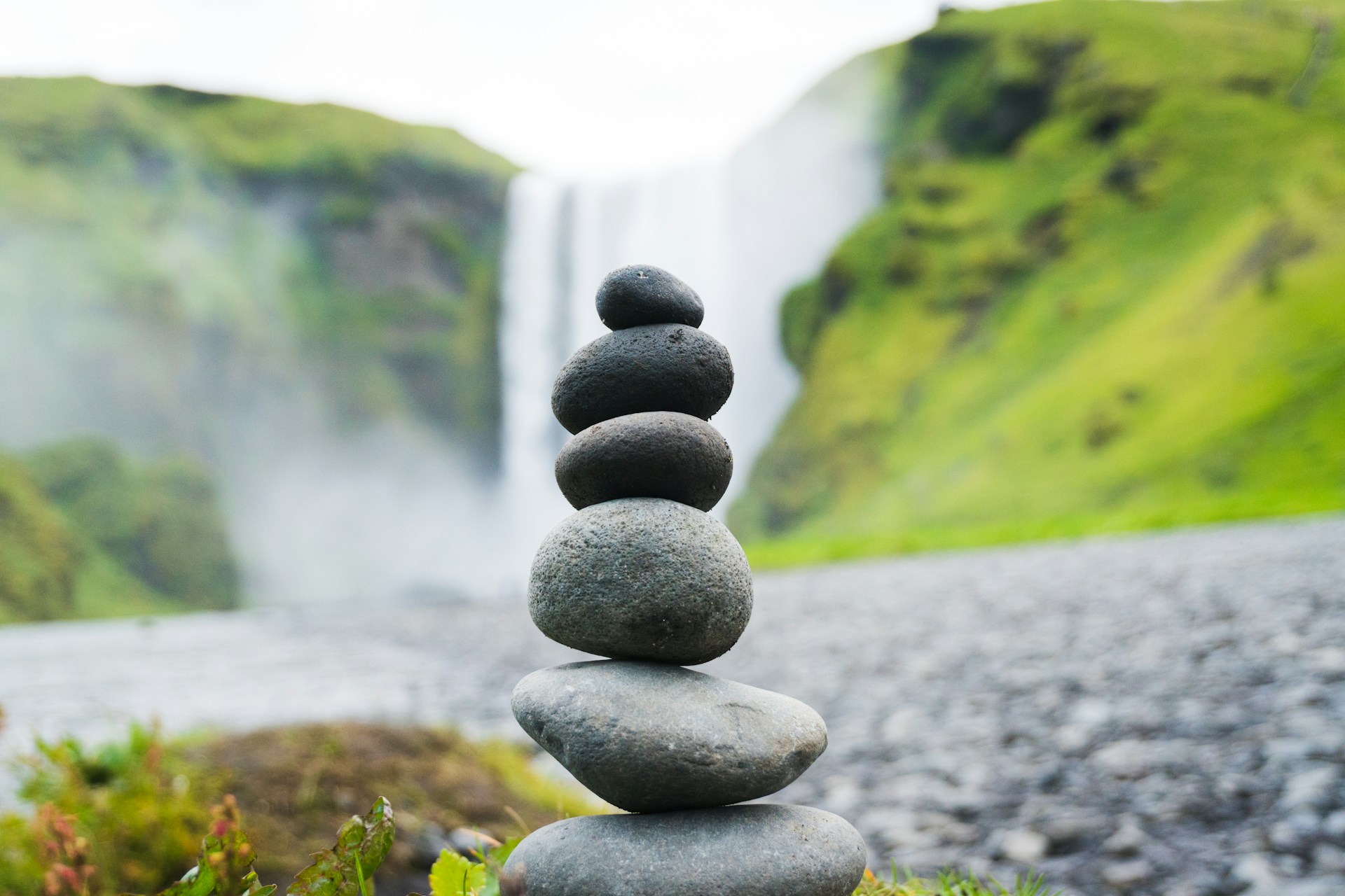 An arrangement of stones, stacked into a small tower. Photo by Martin Sanchez on Unsplash