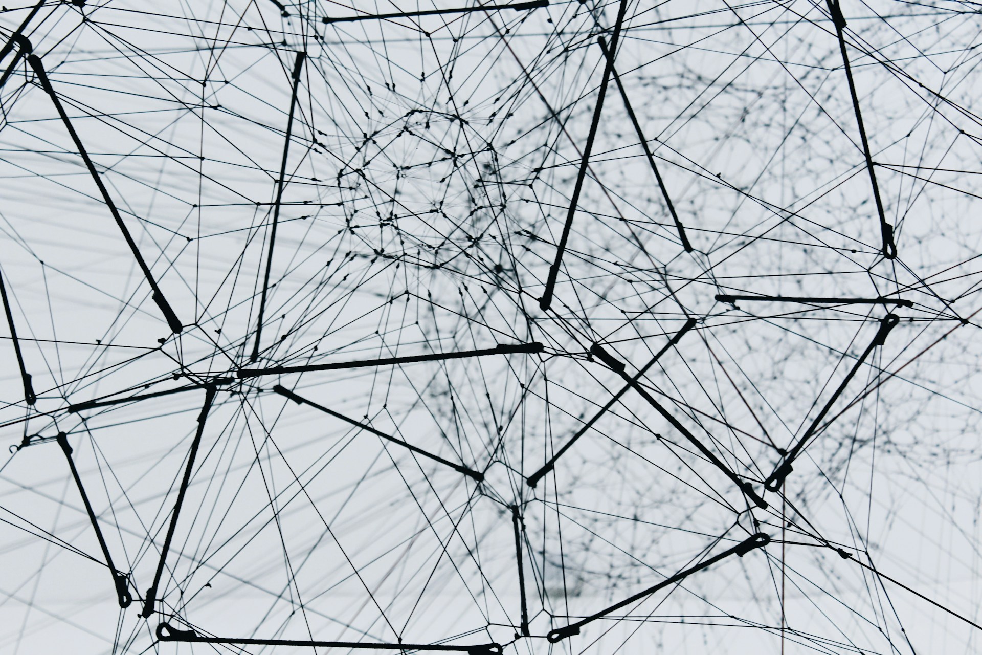A large metal structure, made of interconnected bars. Photo by Alina Grubnyak on Unsplash.