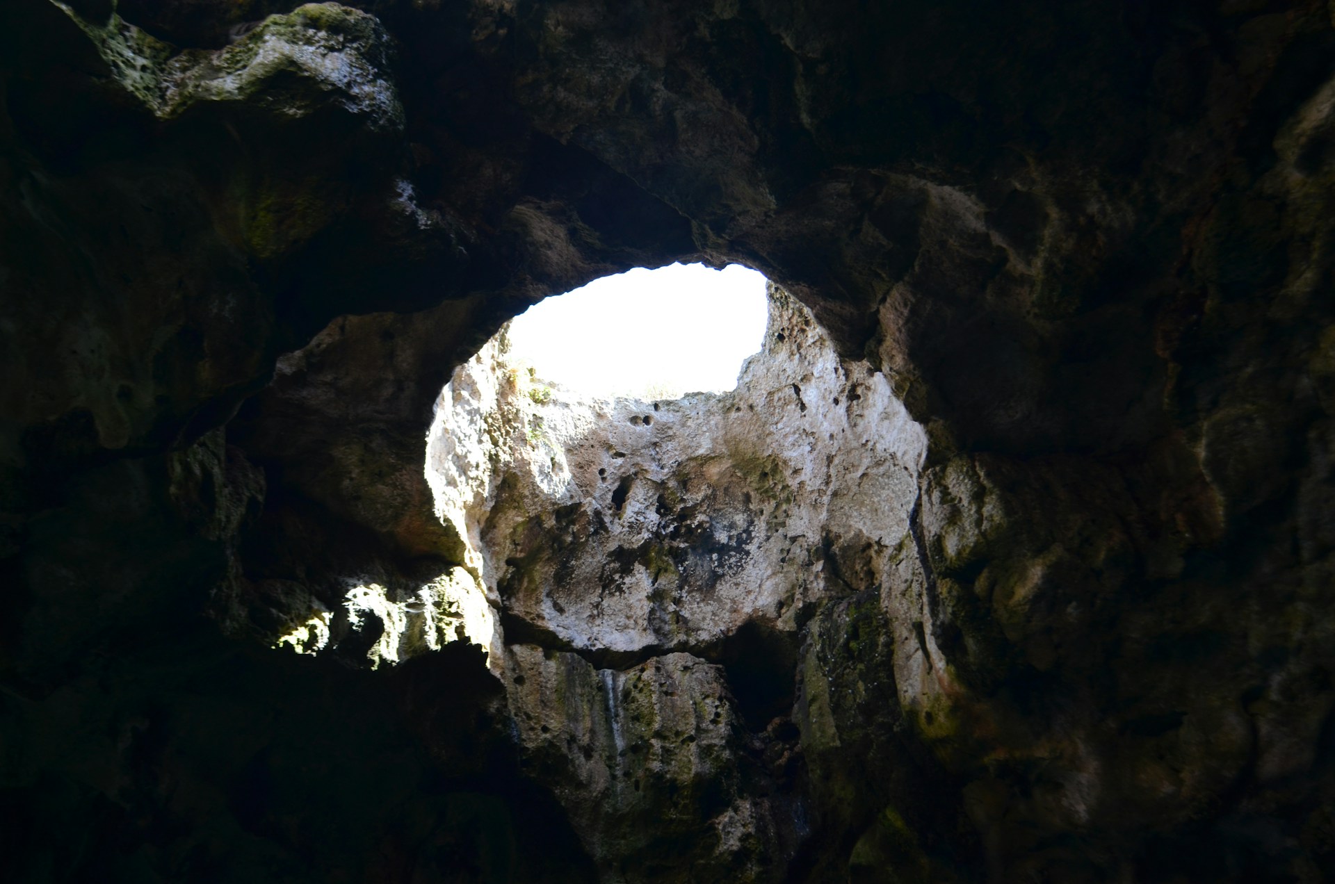 Looking upward, from a hole in the ground. Photo by Marie François on Unsplash.